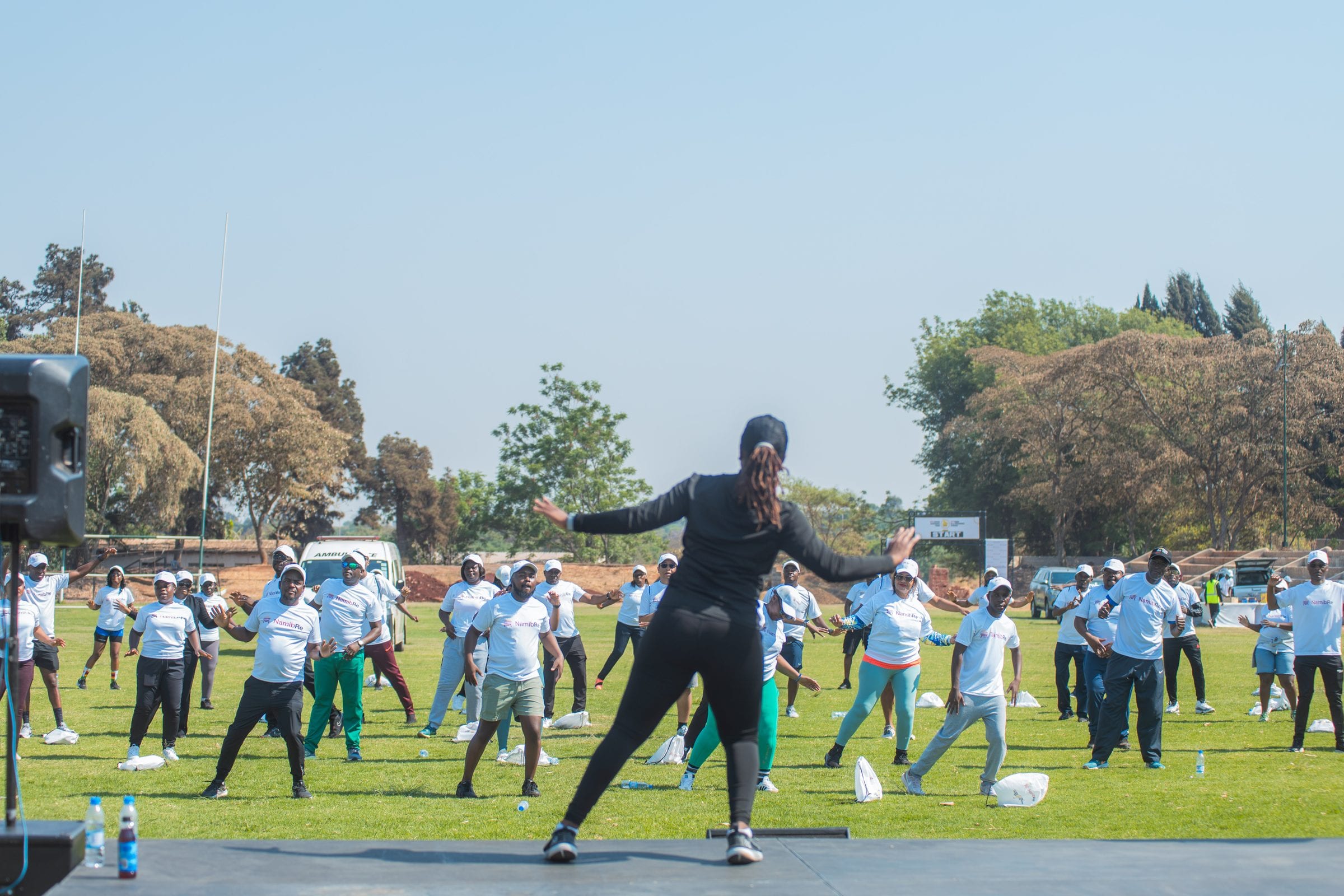 A branded fun run warm-up, participants mid-session